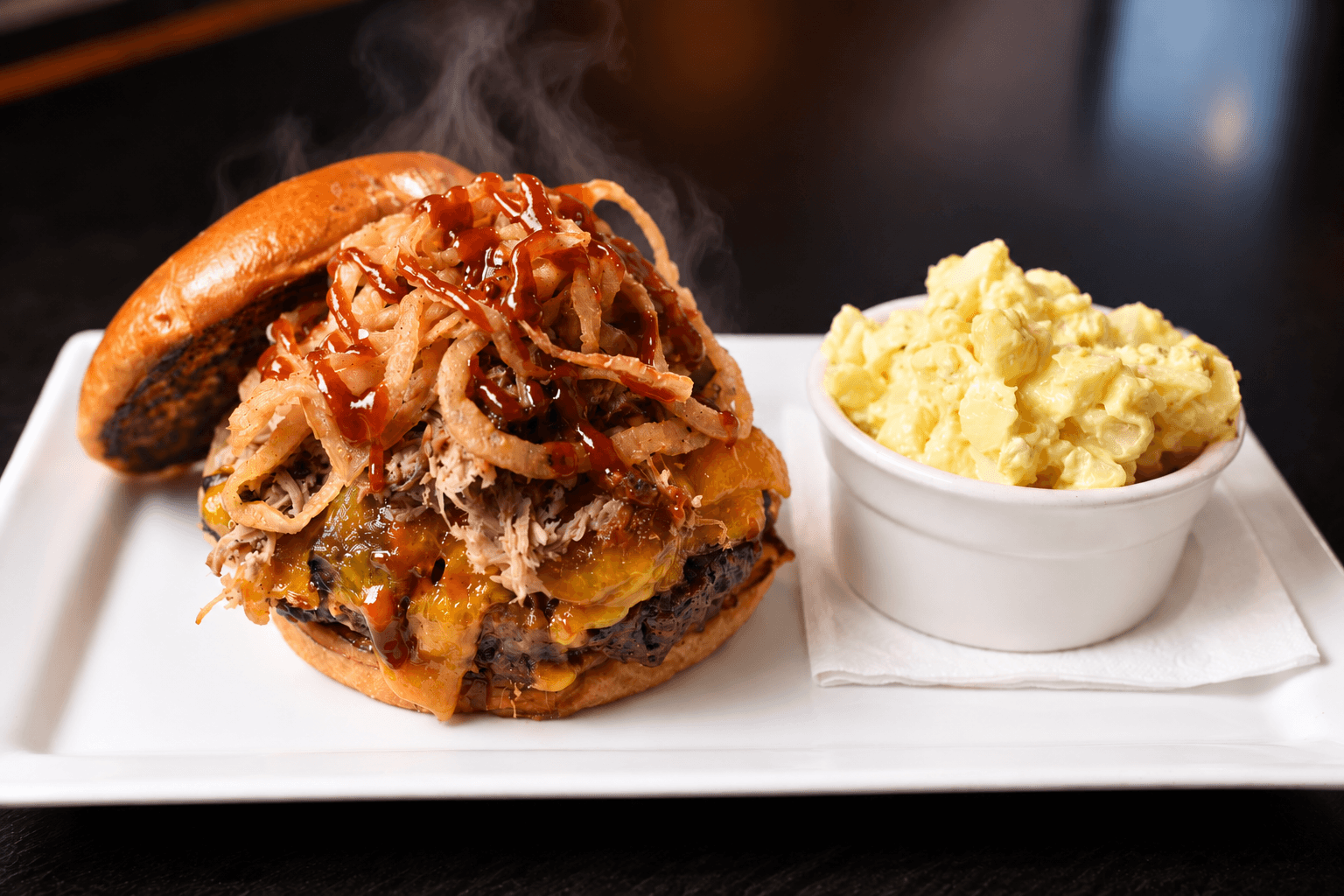 Smokehouse burger topped with pulled pork and onion straws