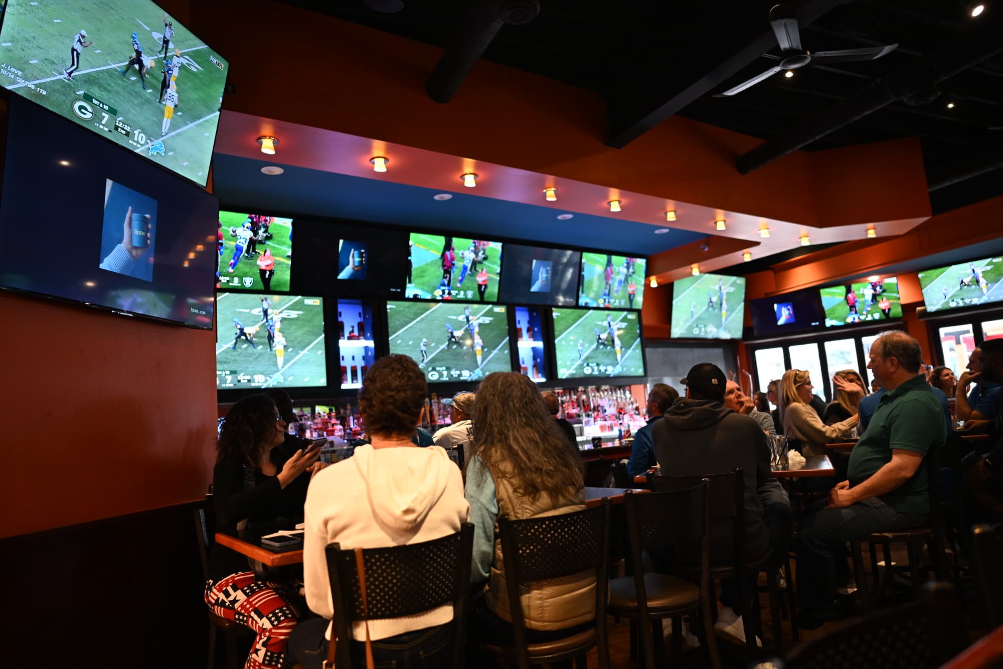 A full dining room watching the game